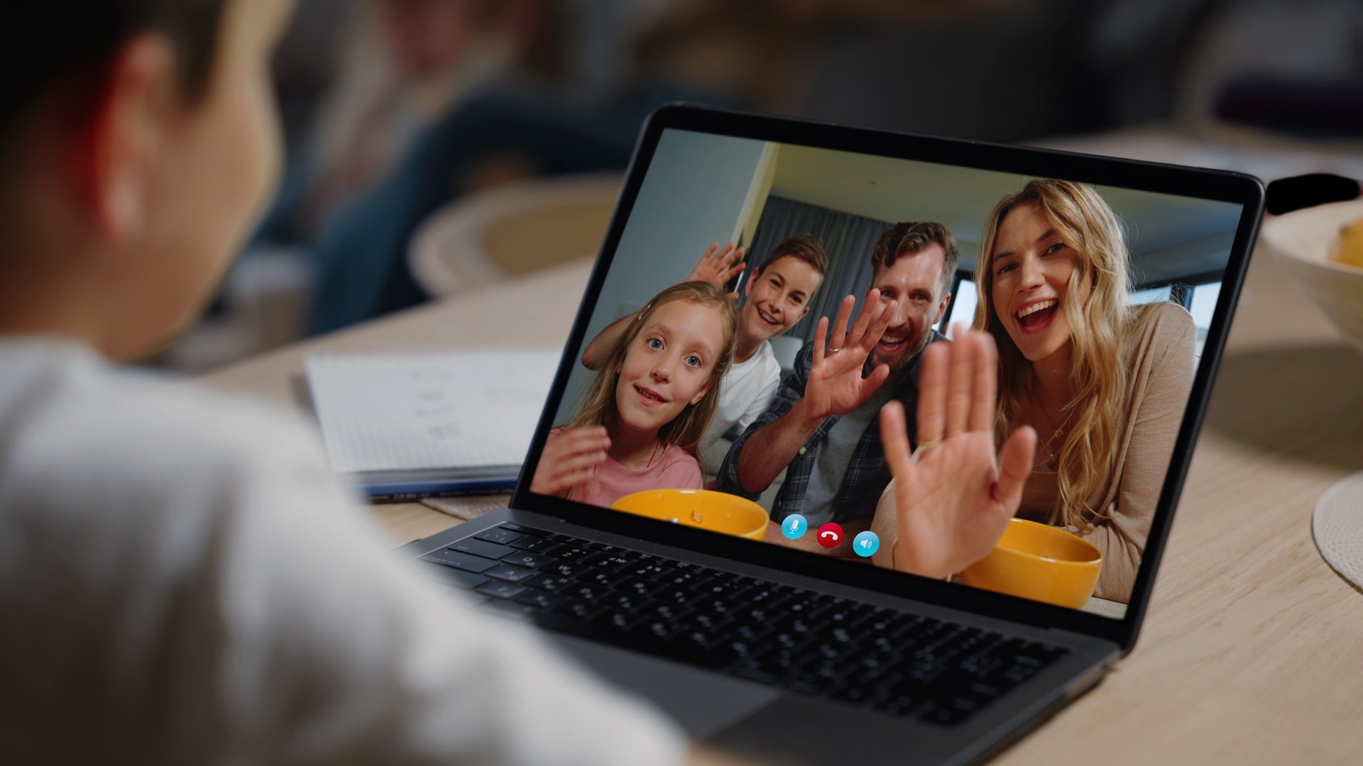 Loving parents video chat with boy closeup. Cheerful family talking by web cam