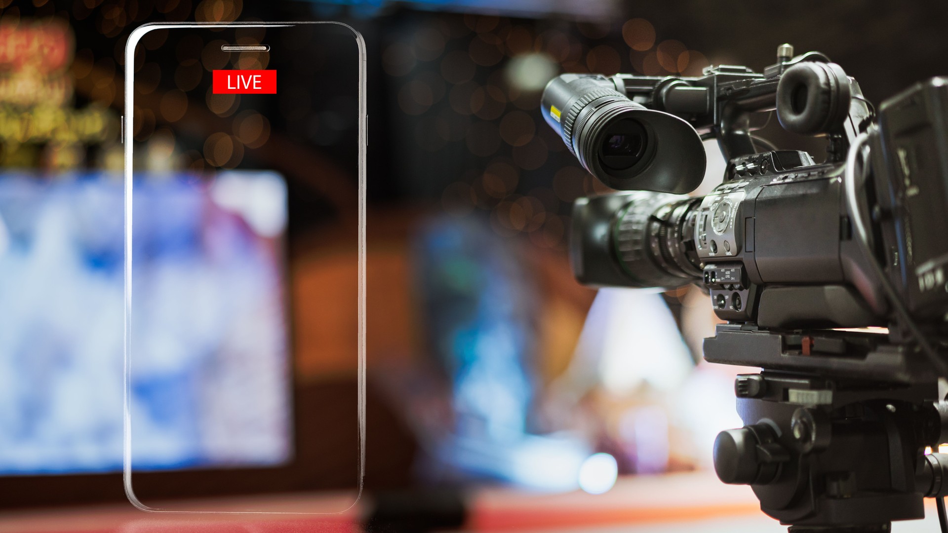 Video camera taking live video streaming with lighting frame of mobile phone and Live text at meeting room.